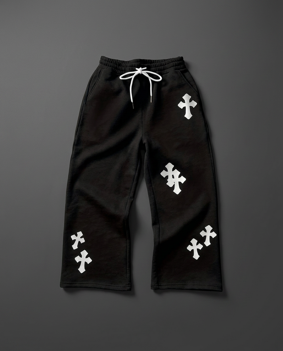 Black cross print sweatpants laid flat